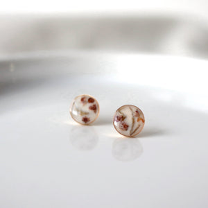 heather flower fragments sit inside 8mm gold earring stud cups. jewelry by Wild Blue Yonder Amber Aasman