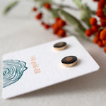 Load image into Gallery viewer, black and brown wood earrings sit against a soft white background. 
