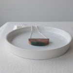 Load and play video in Gallery viewer, Reclaimed wood bark pendant with blue resin and silver chain by Wild Blue Yonder

