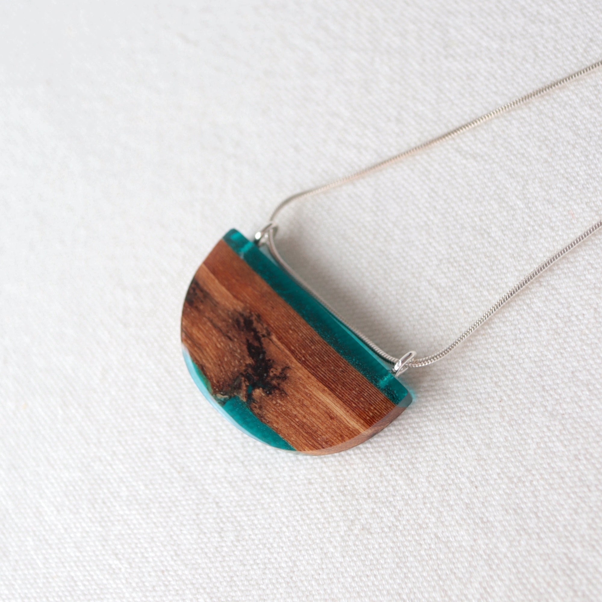 Reclaimed wood bark pendant with blue resin and silver chain by Wild Blue Yonder