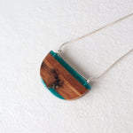 Load image into Gallery viewer, Reclaimed wood bark pendant with blue resin and silver chain by Wild Blue Yonder
