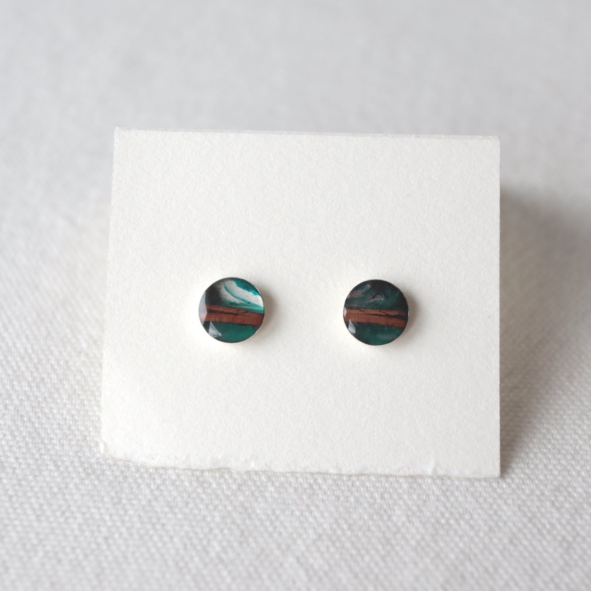 birch bark studs with sterling silver cups and blue resin by Wild Blue Yonder