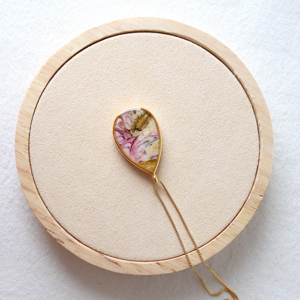 Florals. Encased Gold Teardrop Necklace with Dahlia Flower