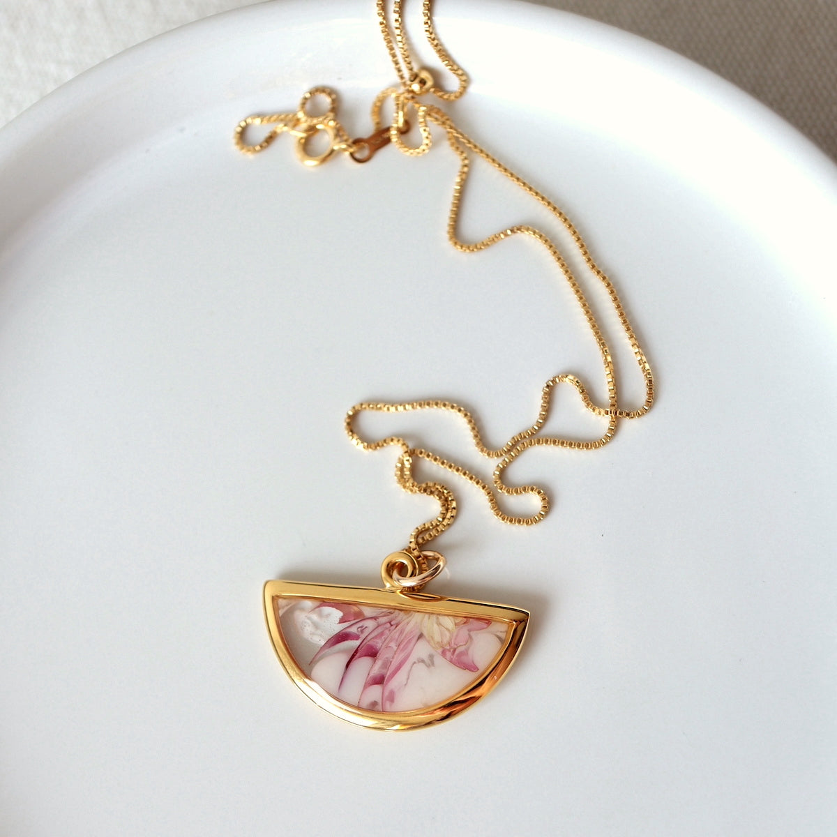 Florals. Encased Gold Half-moon Necklace with Dahlia Flowers
