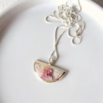 Load image into Gallery viewer, Florals. Encased Gold Half-moon Necklace with Dahlia Flowers

