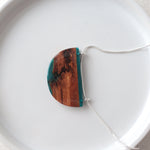 Load image into Gallery viewer, Reclaimed wood bark pendant with blue resin and silver chain by Wild Blue Yonder
