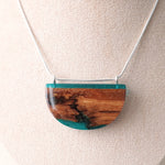Load image into Gallery viewer, Reclaimed wood bark pendant with blue resin and silver chain by Wild Blue Yonder
